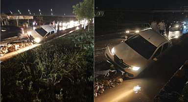 Sağanak yağışlar yolu çöktürdü, bir otomobil mahsur kaldı